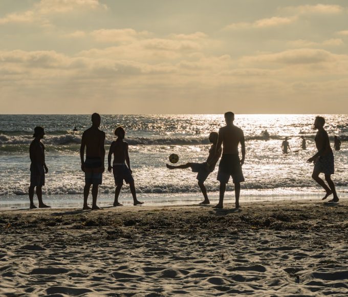 Top Beach Vacation Destinations for Families 23 Photo Family playing beach volleyball